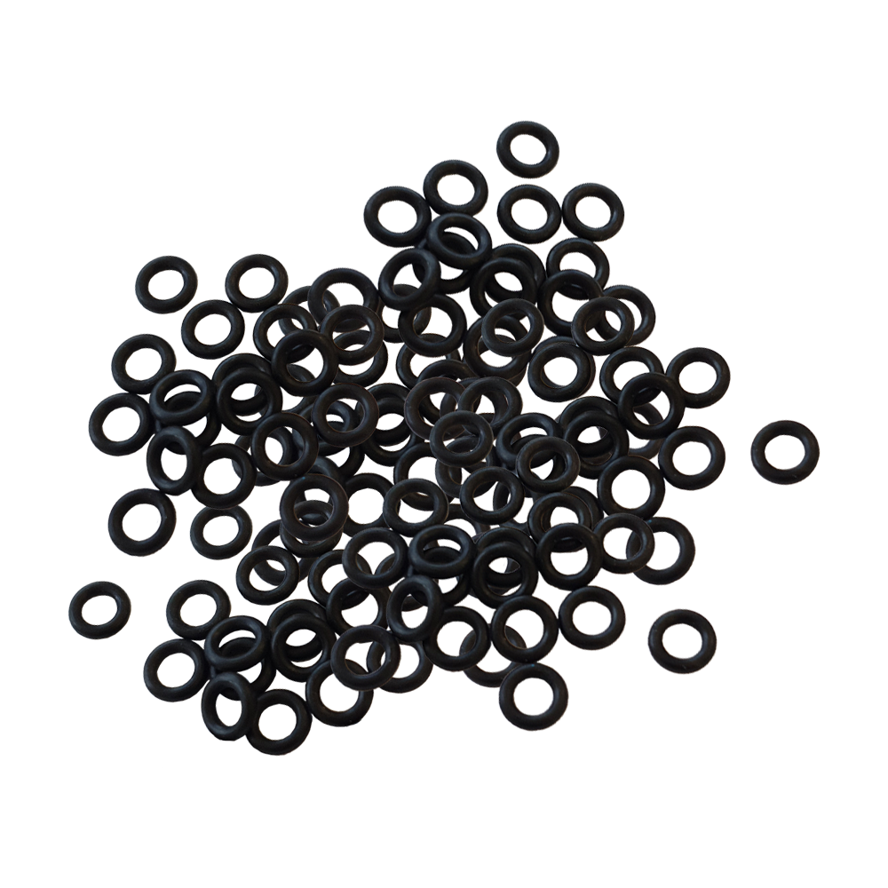 601Y_Shaftgummis_1000er_Set_1 Auf dem Bild sind viele kleine schwarze Gummiringe zu sehen. Es handelt sich um das Produkt "Shaftgummis (1000er Set)".