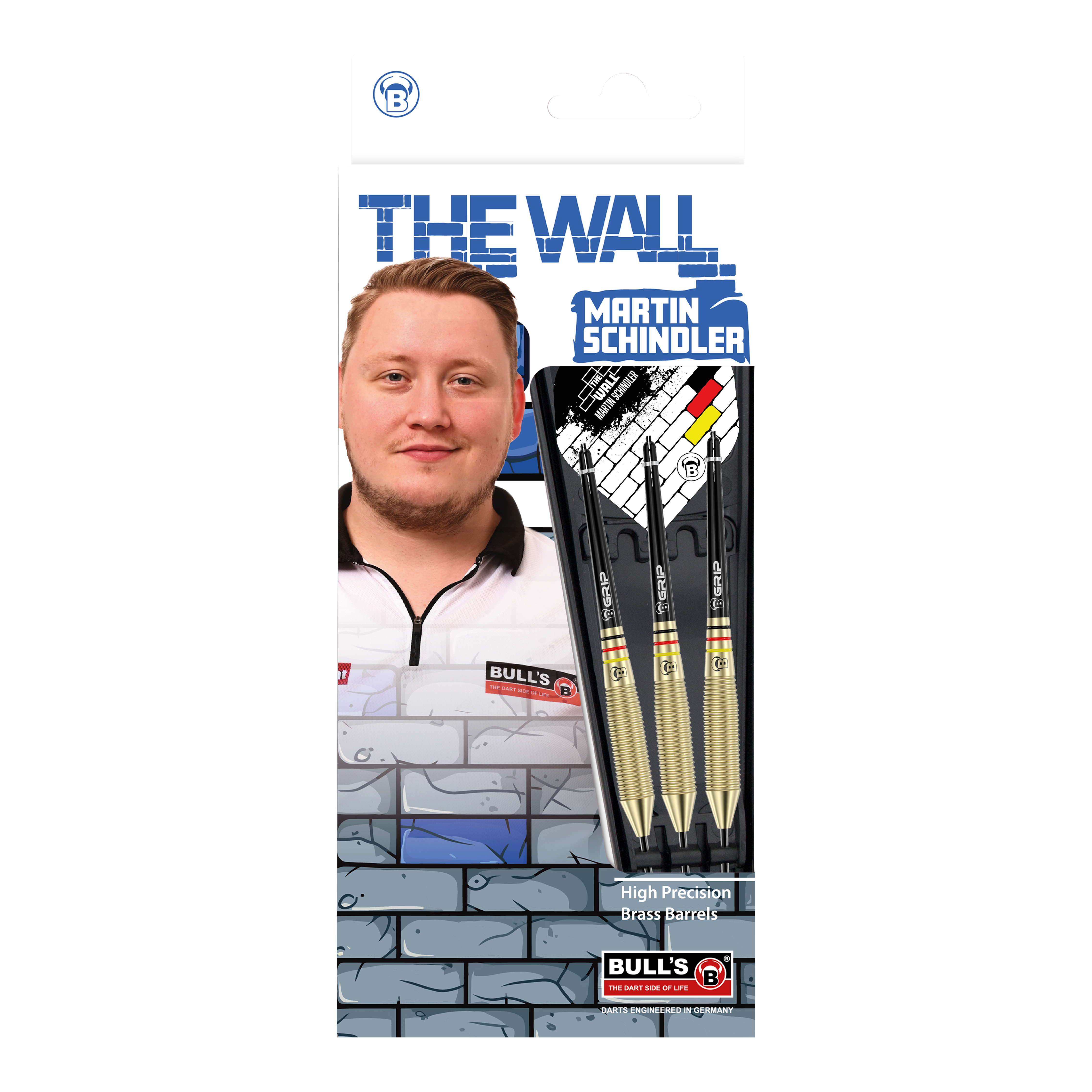 Auf dem Bild ist die Verpackung der "Bulls Martin Schindler The Wall Brass Steeldarts" zu sehen. Sie zeigt ein Foto von Martin Schindler sowie drei Steeldarts mit Messing-Barrels.