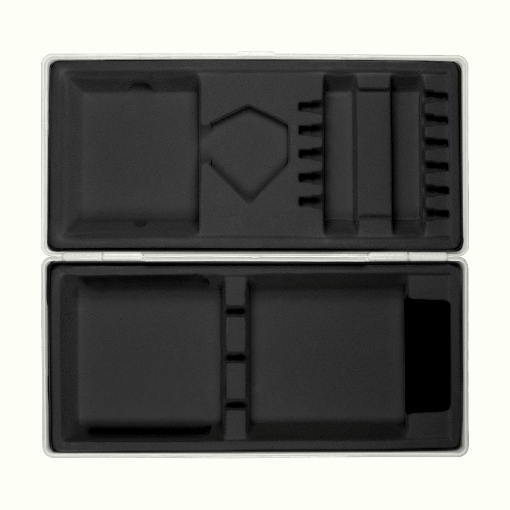 ABS box with custom print Die Abbildung zeigt eine geöffnete graue Box mit passgenauen Fächern aus schwarzem Schaumstoff. Die Box liegt auf einem hellgelben Hintergrund.