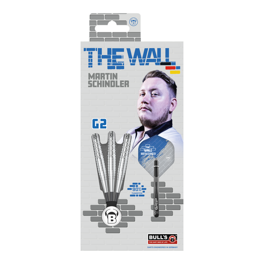 Die Verpackung zeigt die "Bulls Martin Schindler Original Generation 2 Steeldarts" mit dem Bild von Martin Schindler. Auf der Vorderseite sind drei Darts und die Aufschrift "THE WALL" sowie "90% Tungsten" abgebildet.