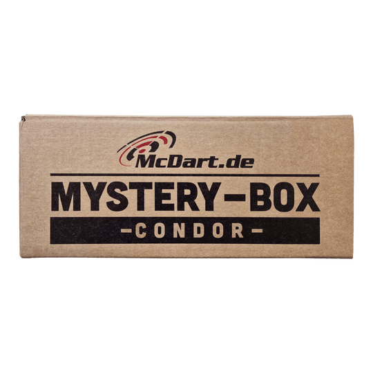 McDart Condor Mystery Box Auf dem Bild ist ein brauner Karton mit der Aufschrift "McDart.de Mystery-Box - Condor -" zu sehen. Die Schachtel wirkt geheimnisvoll und lädt zum Entdecken ein.