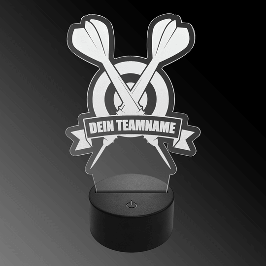 Das Bild zeigt eine LED-Lampe aus Plexiglas in Form von zwei gekreuzten Dartpfeilen vor einer Zielscheibe. Auf einem Banner steht der Text "DEIN TEAMNAME".