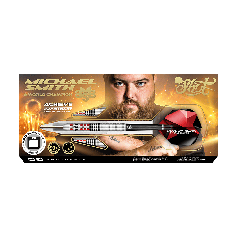 Shot Michael Smith Achieve Steel Darts Auf dem Bild ist eine Verpackung für Steeldarts mit dem Namen „Michael Smith - World Champion“ zu sehen. In der Mitte ist ein Mann mit Bart abgebildet, und ein großer silberner Dartpfeil ist prominent dargestellt.
